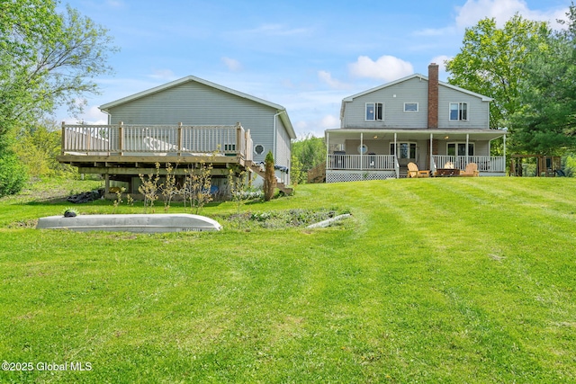 18 Main St, Berne, NY 12059 - back of house with a chimney, a yard, a porch, and a wooden deck