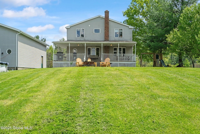 18 Main St, Berne, NY 12059 - rear view of house with a yard, a chimney, and a playground