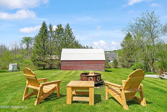 18 Main St, Berne, NY 12059 - view of green lawn featuring a fire pit and an outdoor structure