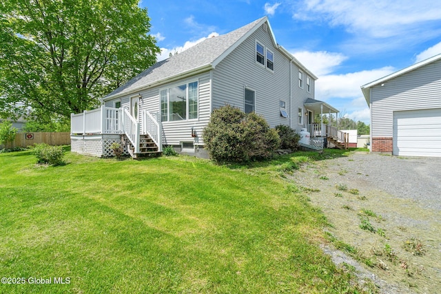 18 Main St, Berne, NY 12059 - view of front of property with a front lawn, a wooden deck, a shingled roof, and gravel driveway