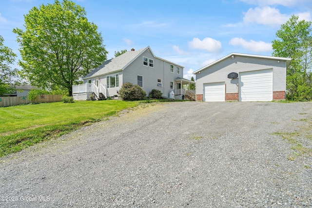 18 Main St, Berne, NY 12059 - view of front facade with a detached garage, an outbuilding, and brick siding