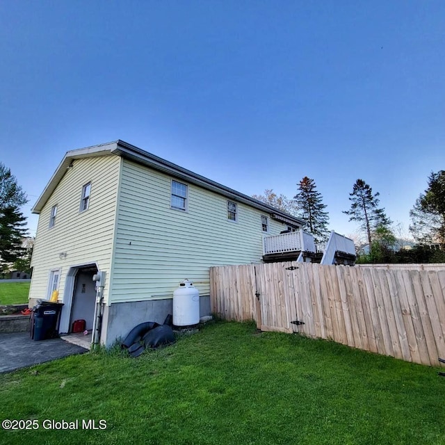 view of home's exterior featuring a garage and driveway