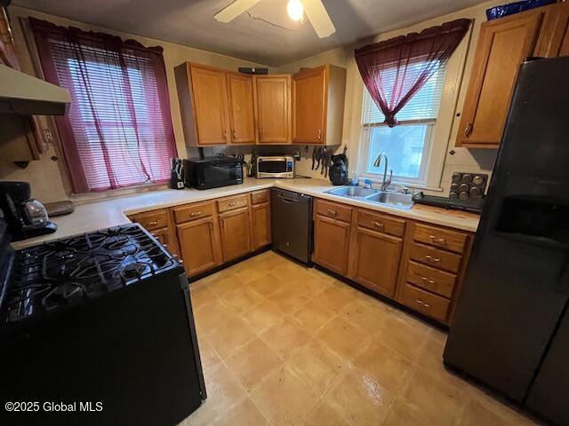 3 Tulip St, Rotterdam, NY 12306 - kitchen featuring black appliances, a sink, light countertops, a ceiling fan, and under cabinet range hood