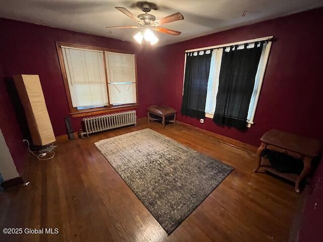 3 Tulip St, Rotterdam, NY 12306 - bedroom featuring radiator, wood finished floors, ceiling fan, and baseboards