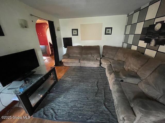 3 Tulip St, Rotterdam, NY 12306 - living room featuring arched walkways and wood finished floors