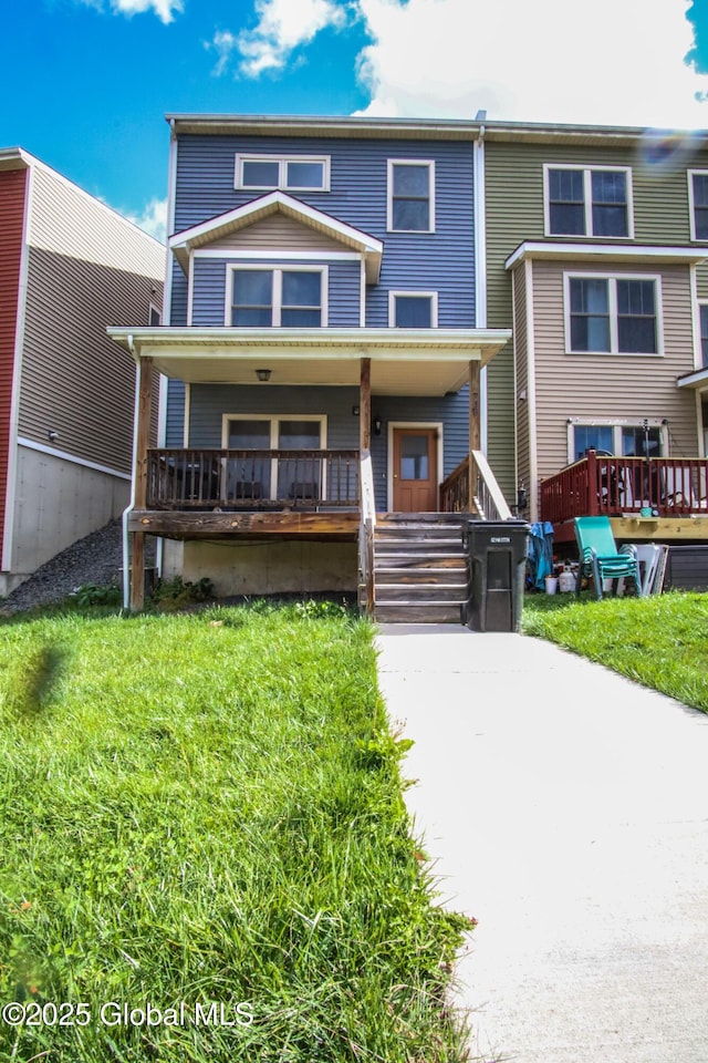 view of front of house with covered porch and a front yard