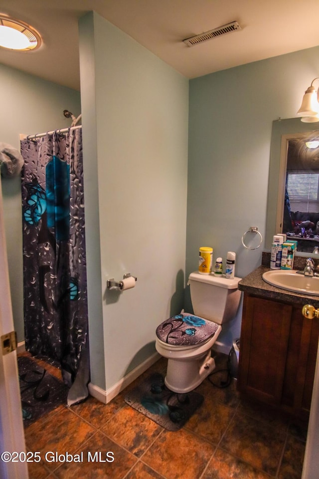 bathroom with toilet, tile patterned floors, vanity, and a shower with shower curtain