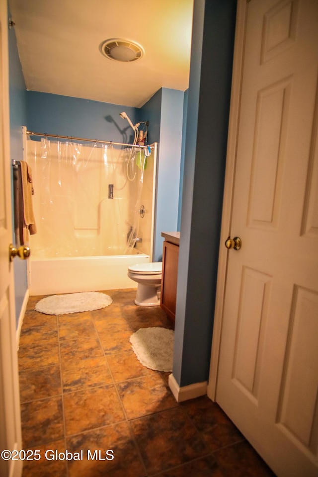 full bathroom featuring toilet, shower / bath combination with curtain, and tile patterned floors