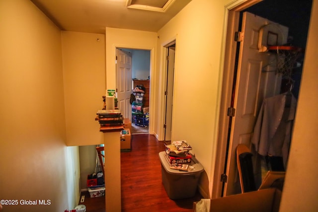 corridor featuring dark wood-style flooring