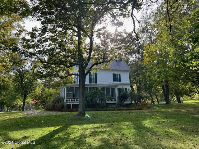 601/603 Baldwin Rd, Ticonderoga, NY 12883 - back of house featuring a lawn