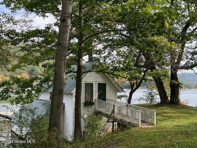 601/603 Baldwin Rd, Ticonderoga, NY 12883 - view of side of property with a lawn and a deck with water view