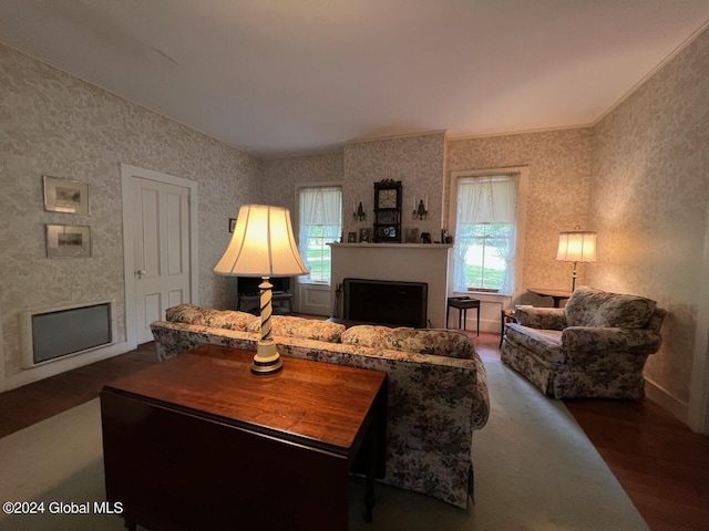 601/603 Baldwin Rd, Ticonderoga, NY 12883 - living room with a fireplace, plenty of natural light, wood finished floors, and baseboards