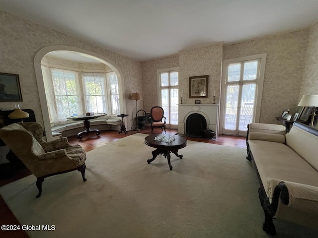 601/603 Baldwin Rd, Ticonderoga, NY 12883 - living area with wallpapered walls, wood finished floors, healthy amount of natural light, and a fireplace
