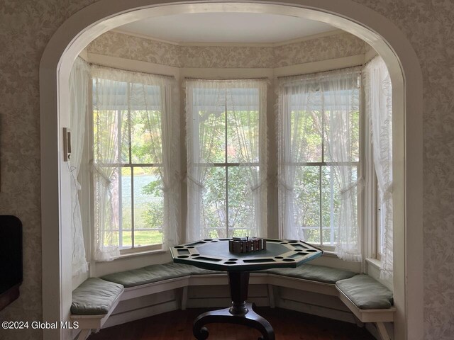 601/603 Baldwin Rd, Ticonderoga, NY 12883 - dining area featuring wallpapered walls, wood finished floors, and arched walkways