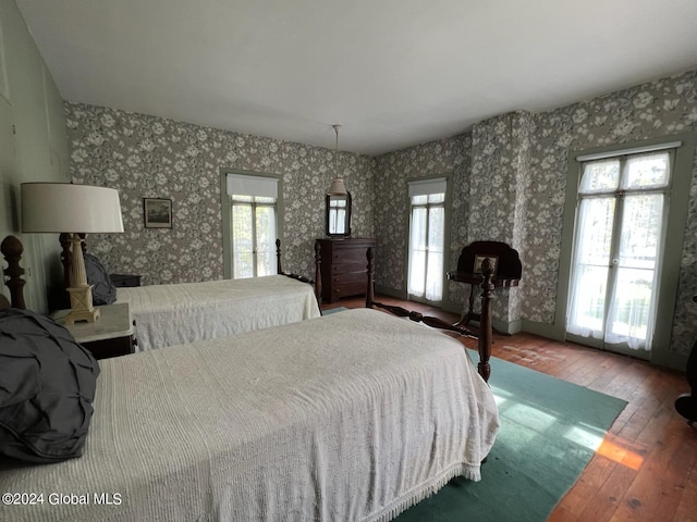 601/603 Baldwin Rd, Ticonderoga, NY 12883 - bedroom with hardwood / wood-style floors and wallpapered walls