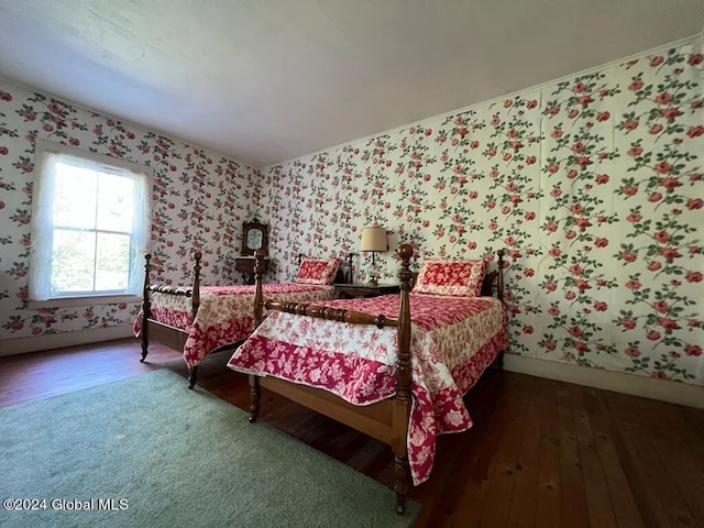 601/603 Baldwin Rd, Ticonderoga, NY 12883 - bedroom featuring wood-type flooring, wallpapered walls, and baseboards