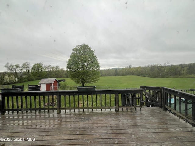 2299 Coach Rd, Argyle, NY 12809 - wooden deck with a storage unit, an outdoor structure, and a yard