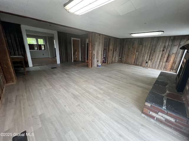 2299 Coach Rd, Argyle, NY 12809 - below grade area with wooden walls and light wood-type flooring