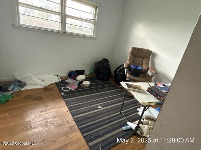 unfurnished bedroom featuring wood finished floors