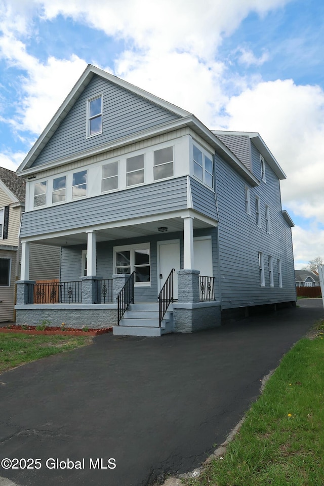 traditional style home with covered porch