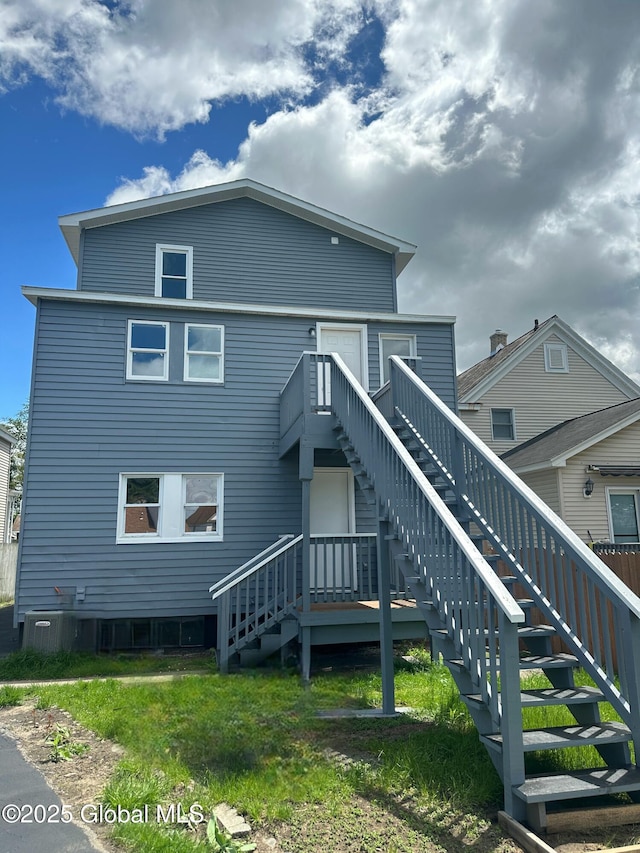 rear view of house with stairs