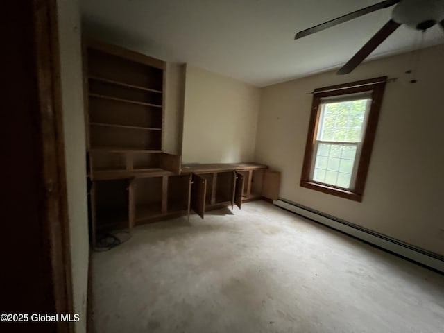 92 N Pearl St, Schaghticoke, NY 12118 - miscellaneous room featuring a baseboard radiator, ceiling fan, and unfinished concrete flooring