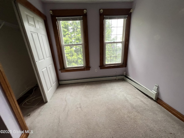 92 N Pearl St, Schaghticoke, NY 12118 - spare room featuring light carpet, healthy amount of natural light, baseboards, and baseboard heating