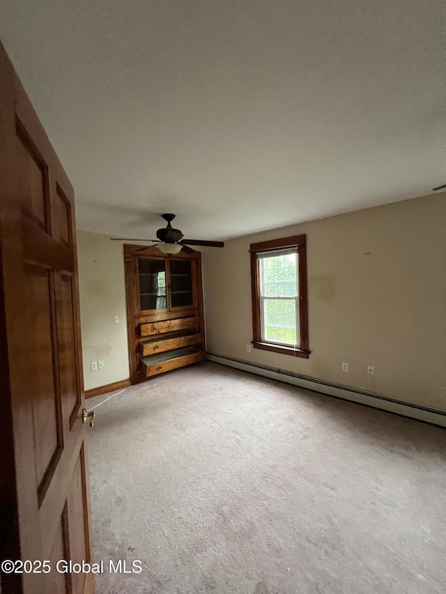 92 N Pearl St, Schaghticoke, NY 12118 - spare room with light colored carpet, a ceiling fan, baseboards, and baseboard heating
