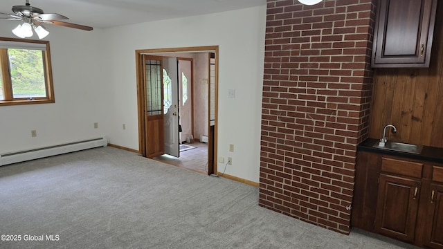 505 Elm Ave, Bethlehem, NY 12158 - spare room featuring a sink, baseboard heating, ceiling fan, light carpet, and baseboards