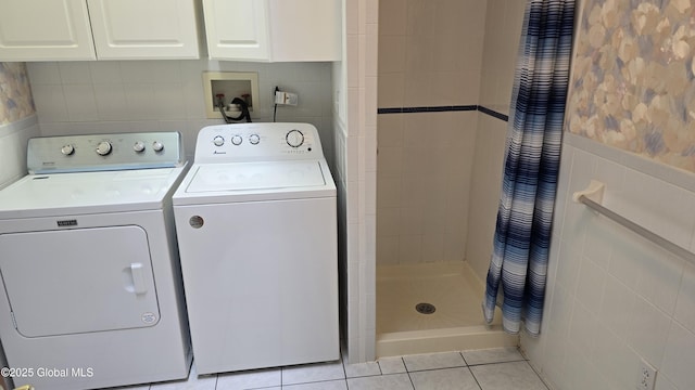 505 Elm Ave, Bethlehem, NY 12158 - laundry room featuring washer and clothes dryer, tile walls, and light tile patterned floors