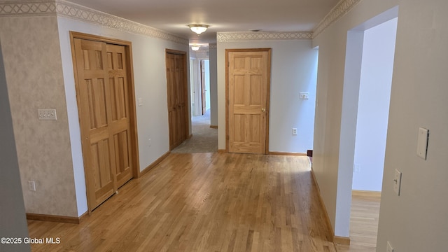 505 Elm Ave, Bethlehem, NY 12158 - hallway featuring light wood finished floors, ornamental molding, and baseboards