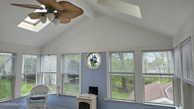 505 Elm Ave, Bethlehem, NY 12158 - sunroom / solarium featuring a skylight, plenty of natural light, high vaulted ceiling, a wood stove, and beamed ceiling