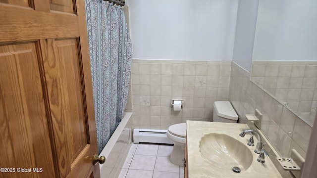 505 Elm Ave, Bethlehem, NY 12158 - bathroom featuring a baseboard heating unit, toilet, tile patterned flooring, shower / tub combo with curtain, and vanity