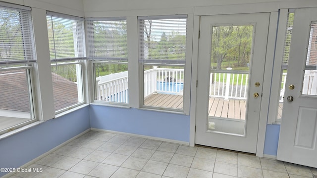 505 Elm Ave, Bethlehem, NY 12158 - doorway to outside with plenty of natural light, baseboards, and light tile patterned floors