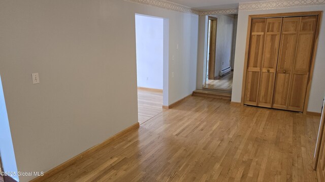 505 Elm Ave, Bethlehem, NY 12158 - corridor with light wood-style flooring, baseboards, crown molding, and a baseboard heating unit