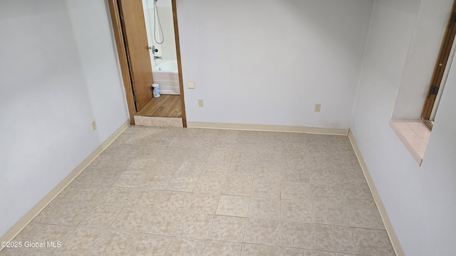 505 Elm Ave, Bethlehem, NY 12158 - spare room with light tile patterned floors and baseboards