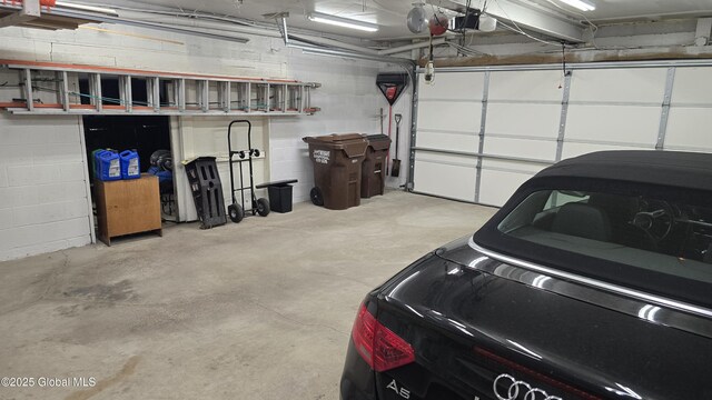 505 Elm Ave, Bethlehem, NY 12158 - garage with a garage door opener and concrete block wall
