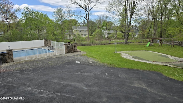 505 Elm Ave, Bethlehem, NY 12158 - view of home's community featuring a pool, a putting green, a playground, and a patio area