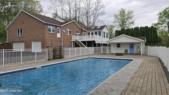 505 Elm Ave, Bethlehem, NY 12158 - view of swimming pool with stairway, a fire pit, a patio, and a fenced backyard