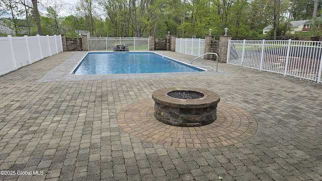 505 Elm Ave, Bethlehem, NY 12158 - view of swimming pool with an outdoor fire pit, a fenced backyard, and a patio