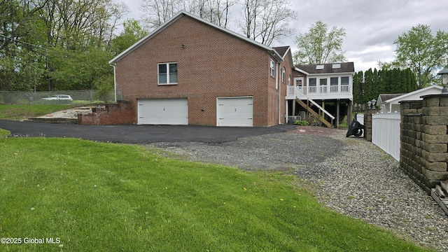 505 Elm Ave, Bethlehem, NY 12158 - view of side of property featuring driveway, an attached garage, stairs, and brick siding