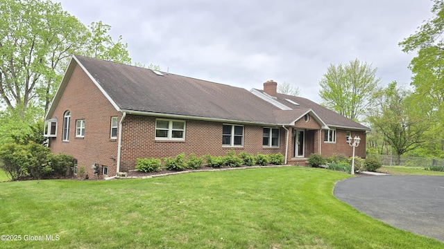505 Elm Ave, Bethlehem, NY 12158 - ranch-style house featuring a chimney, brick siding, and a shingled roof