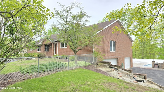 505 Elm Ave, Bethlehem, NY 12158 - view of home's exterior featuring brick siding and an attached garage