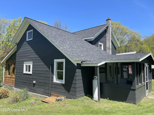 1054 Vly Smt, Cambridge, NY 12834 - view of property exterior featuring roof with shingles, a chimney, and a sunroom
