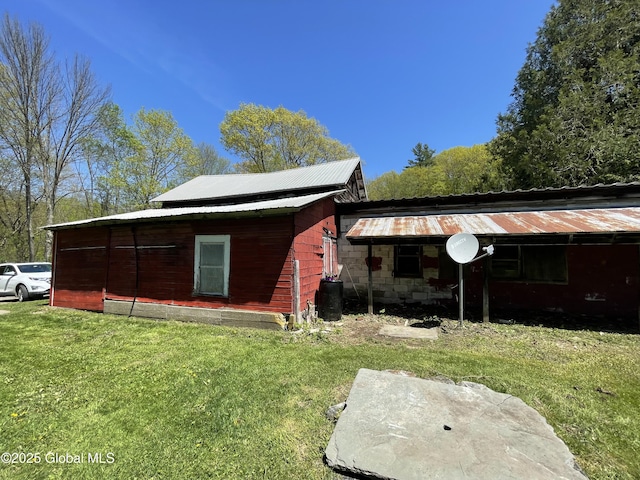 1054 Vly Smt, Cambridge, NY 12834 - rear view of house featuring a lawn and metal roof