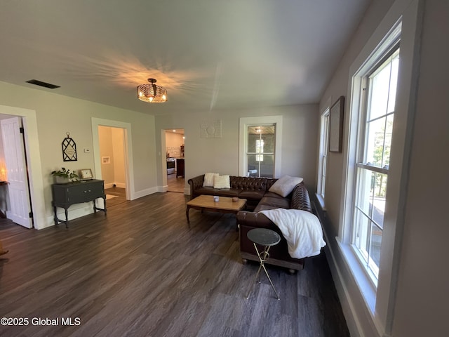 1054 Vly Smt, Cambridge, NY 12834 - living room featuring plenty of natural light, dark wood-style floors, baseboards, and a chandelier