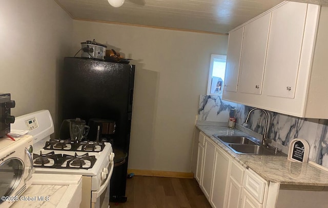 kitchen with white gas range, a sink, dark wood-style floors, and white cabinets