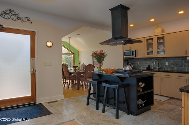 138 Church St, Saratoga Springs, Inside, NY 12866 - kitchen featuring island exhaust hood, stainless steel microwave, a sink, a center island, and tasteful backsplash