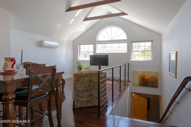 138 Church St, Saratoga Springs, Inside, NY 12866 - living room with wood finished floors, vaulted ceiling, an AC wall unit, and baseboards