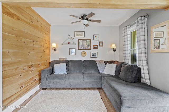 109 Wood Rd, Ballston Spa, NY 12020 - living area with ceiling fan, wood walls, and wood finished floors
